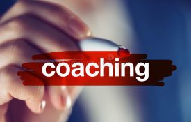 business-coaching-concept-businesswoman-highlighting-term-red-marker-pen-85260284